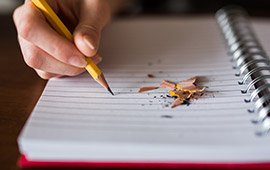 Student working on academic notes